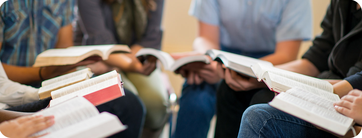 group-holding-bibles.png